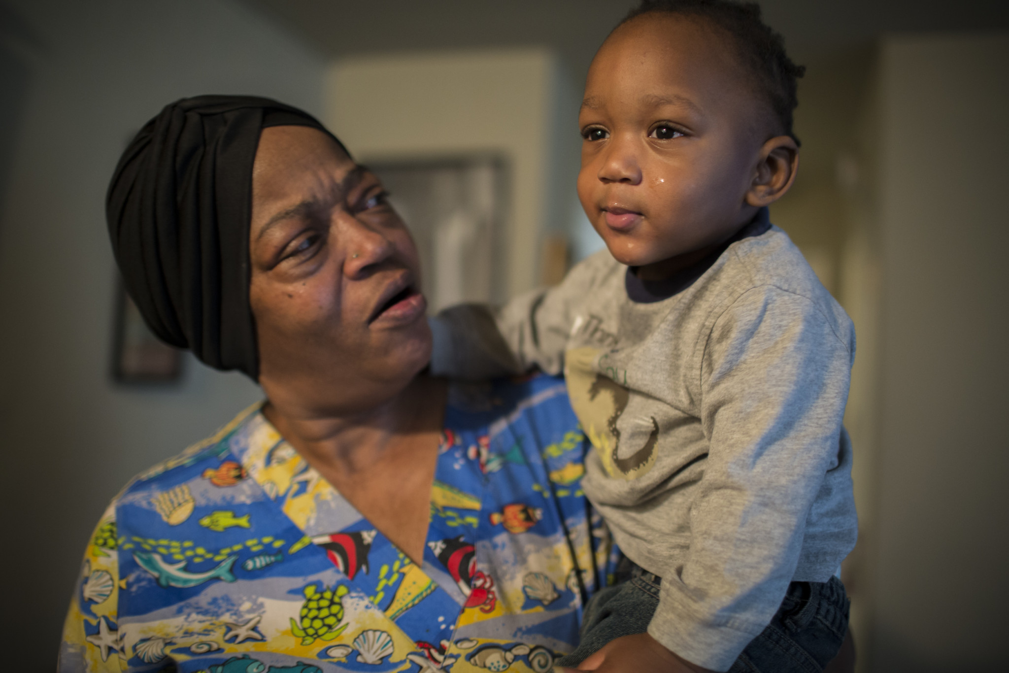 Tonya Kamara holds her grandson, Antonio, whom she has been taking care of since his mother was incarcerated. Because of her daughter’s ongoing drug addiction and erratic behavior, which Ms. Kamara believes threatens Antonio’s safety, she is applying for permanent custody of Antonio. 